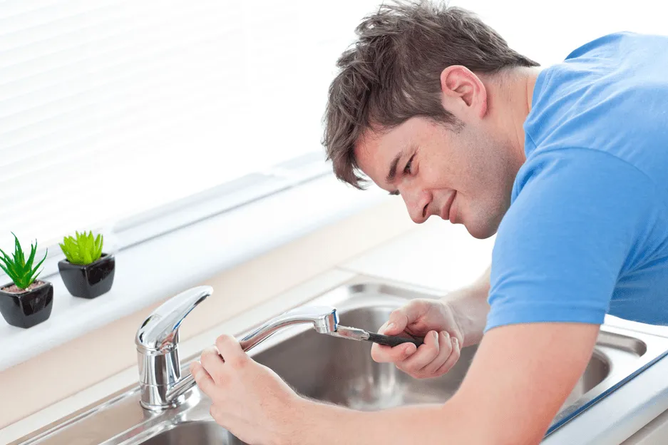 Technician clearing a sewer backup